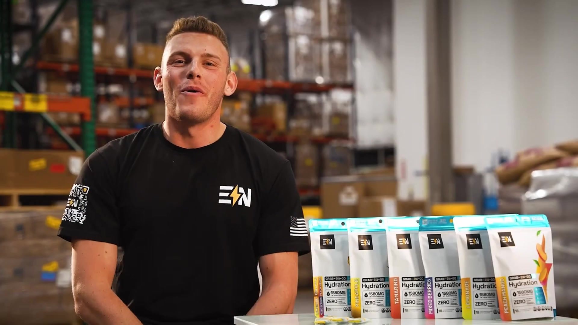 Engineered Nutrition founder in the warehouse with the product line