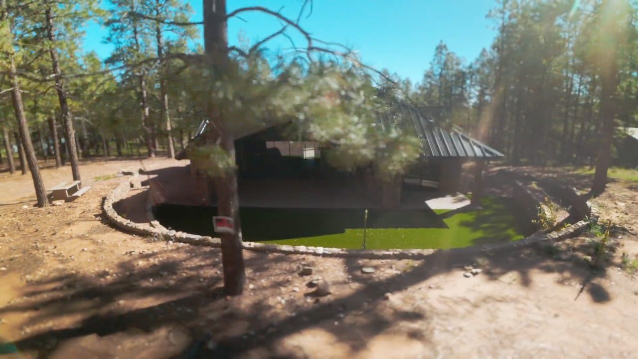 Cabin property surrounded by pines with a putting green, Forest Lakes Arizona, filmed by Maken Media